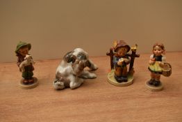 A Lladro porcelain animal study 'Dog and Butterfly' model number 4917 sold alongside three Goebel