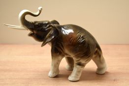 A Royal Dux bone china elephant study bearing stamp '378 and 927' to underside but no pink