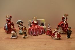 A group of seven Royal Doulton bone china figurines comprising 'Little Jack Horner' HN 2063, '
