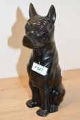 A sweet 20th-century decorative cast and patinated metal boxer dog, of seated form with a peaceful