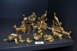A selection of vintage brass animal ornaments, to feature rabbits; poodles; a pair of peacocks; a