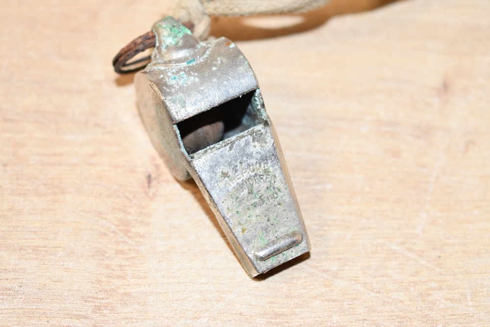 A vintage The Acme metal sports whistle, with rope attached, marked to whistle, 5cm, condition is - Image 2 of 2