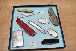 A selection of 20th-century pen knives and multi tools, to include a red Victorinox multi-tool and a