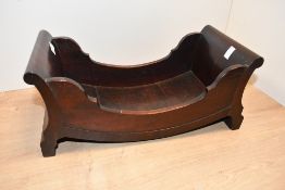 Thought to be a Georgian mahogany cheese coaster/cradle, featuring a slatted bateau design,