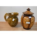A 20th-century Sylvac Pottery lidded ginger jar, featuring raised peacock and floral relief