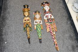 A group of three 20th century carved and painted Thai/Balinese Dewi Sinta mermaid wall