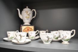 An early 20th-century Crown Staffordshire fine bone china 'Game Bird' tea set, featuring hand