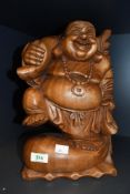 A vintage Balinese-style hand carved wooden Laughing Buddha statue, unmarked, 33cm, condition is