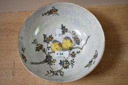 An early 20th-century Carlton Ware lustre bowl, featuring a Chinisorie-inspired scene of two soft