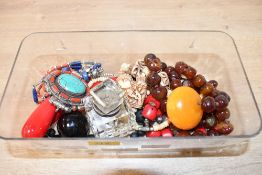 A small assortment of costume jewellery, including an agate statement necklace and white metal