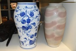 A large late 20th-century Chinese-style blue and white floor vase, featuring peach tree motif