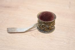 A late 19th-century German Deutsches Reichs-Gebrauchsmuster gilt metal tape measure, with a purple