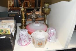 A selection of late 19th to early 20th-century lamp fittings, to include two oil lamps; a gilt-brass