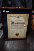 A vintage dark wood display frame, featuring brass hinge detailing; sold with a early 20th-century