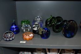 A selection of 20th-century art glass paperweights, to feature a set of three Murano-style graduated