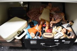 A selection of vintage children's dolls clothing, shoes and more, contained in two cases, various
