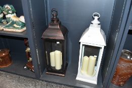 Two large contemporary Smart Garden lanterns, featuring LED flickering candles, marked to base, (2),