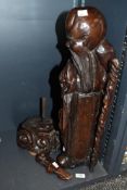 A large Carved Chinese hardwood immortal Shou Hsing, modelled holding a staff and looking to one