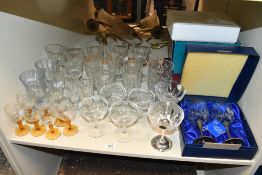 A large selection of late 19th to 20th-century glassware, to feature eight sherry glasses with amber