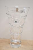 A late 20th-century Rockingham hand cut crystal vase, to feature swirled etched detailing, with