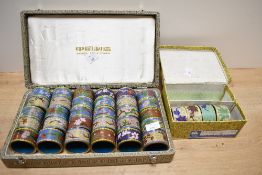 A large selection of 20th-century Chinese Cloisonné enamel napkin rings, featuring a colourful array