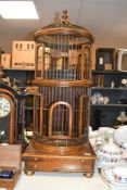 A fine 20th-century Theodore Alexander–style wooden bird cage, of tall circular form and Victorian