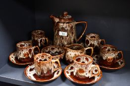 A vintage Fosters Studio Pottery coffee set, featuring a 'honeycomb' brown drip glaze, to include