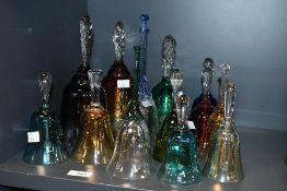 A fine selection of late 19th to 20th-century colourful glass hand bells, of varying colours and