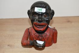 A large 20th-century painted cast iron 'Jolly Gent' mechanical money bank, featuring a lever that