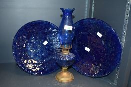 An unusual mid 20th-century cobalt blue glass oil lamp, having a diamond-quilted reserve