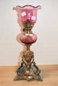 A fine Victorian Henry Wilkinson and Company patinated brass and silver-plated oil lamp, featuring a