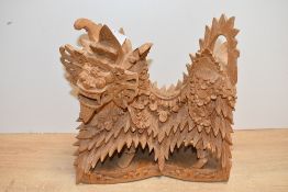A late 20th-century Balinese hand carved wooden Barong (dragon) statue, featuring detailed floral