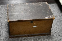 A large early 20th-century wooden trunk, having a hinged lid and twin handles, unmarked, 53cm x 33cm