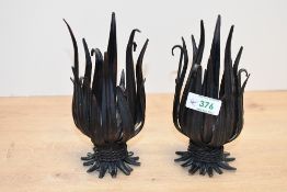 Two unusual late 20th-century metal Folk Art-style wheat candle holders, featuring stylised metal