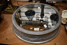 An unusual mid 20th-century bevelled metal Wedding cake display stand, of circular-form, featuring a