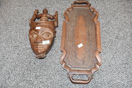 A 20th-century West African hand-carved wooden mask, presumed to be an Ivory Coast example, having a