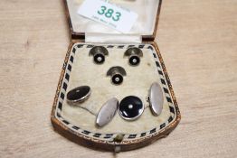 A cased set of white metal onyx and pearl set cufflinks and collar studs, 9.6g