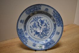 A 19th century Chinese export porcelain plate, of dished circular form, hand decorated with