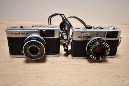 Two Olympus cameras. An Olympus 35RC and an Olympus Trip 35