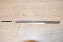 A presumed late 19th-century to early 20th-century white metal extendable dip pen, having an