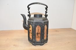 A late 19th to early 20th-century Chinese pewter teapot, of octagonal form featuring panels