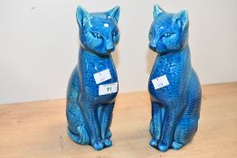 A pair of unusual mid 20th-century Chinese-style turquoise blue glazed ceramic mantel cats,