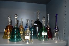 A fine selection of late 19th to 20th-century colourful glass hand bells, of varying colours and siz