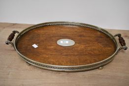 A late 19th-century Johnson & Co of Birmingham oval oak serving tray, featuring an EPNS gallery with