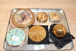 A vintage Pygmalion novelty 'Globe' powder compact, featuring gilt brass outer engraved with