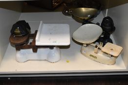 A selection of late 19th to early 20th-century metal, cast iron and brass scales, to feature a