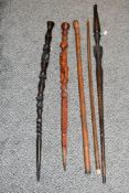 Of ethnographic interest, five late 19th to 20th-century hand carved wooden walking sticks, to