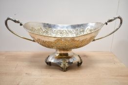A 20th-century gilt metal pedestal centrepiece bowl, featuring intricate embossed floral and foliate
