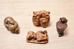 Four 20th-century boxwood and resin Japanese Netsuke animal figures, to feature two frog examples, a