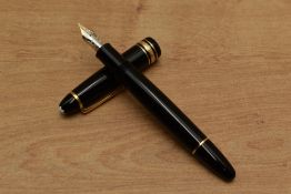 A Montblanc Meisterstuck cartridge fill fountain pen (MK1073238) in black with gold trim having 4810